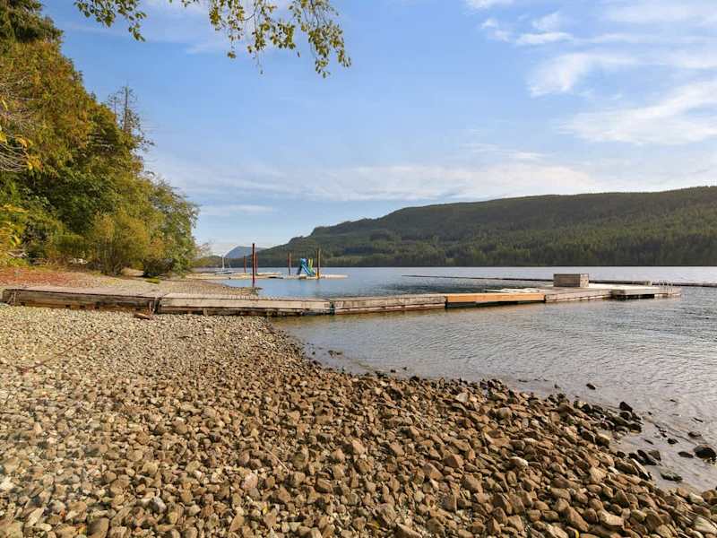 Lakeside beach and private dock.