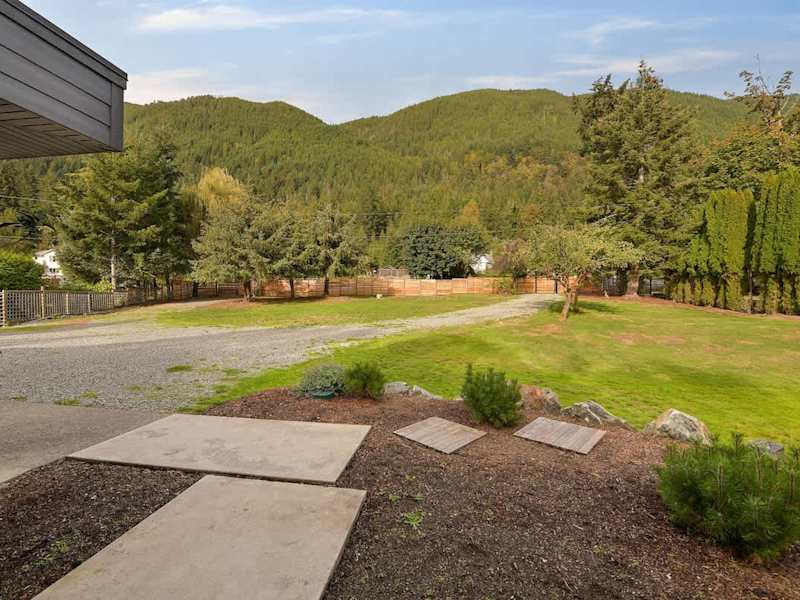 Parking area and main house entrance plus massive front yard.