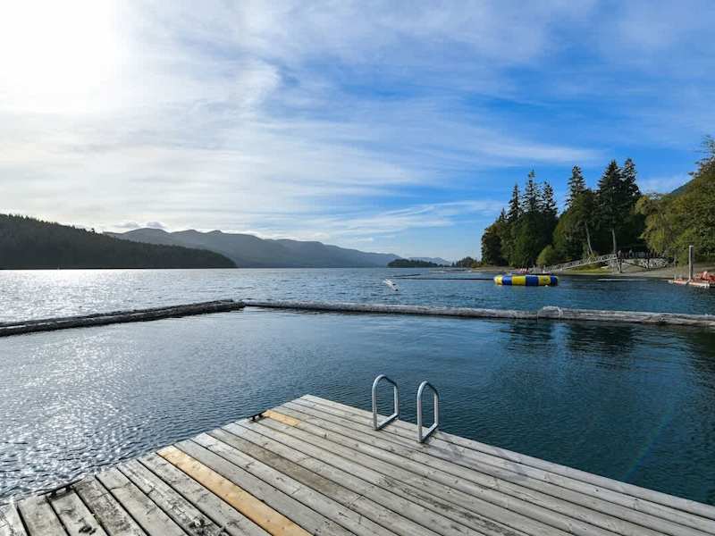 Lakeside beach and private dock.