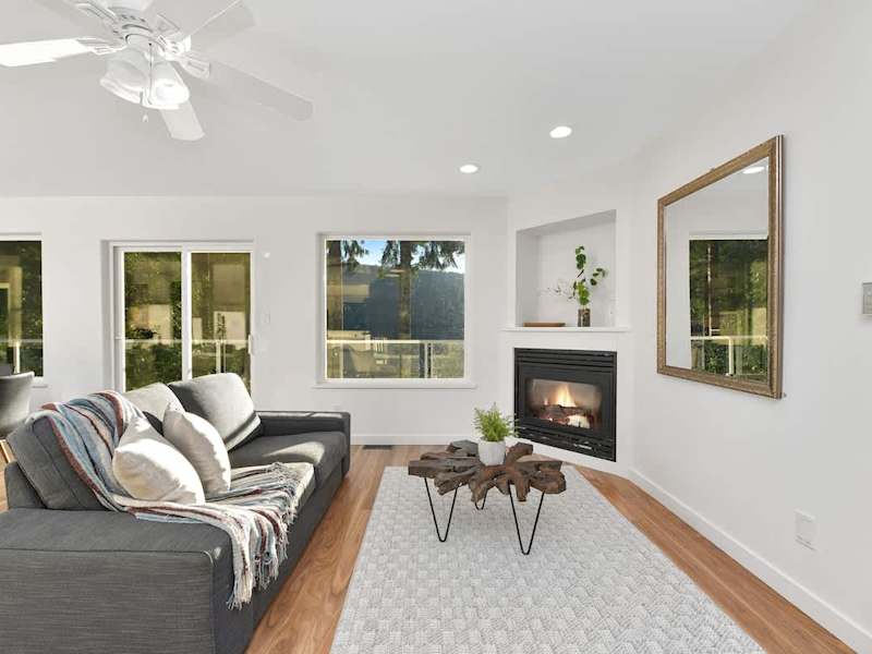 Main level addition living space near kitchen and dining room.