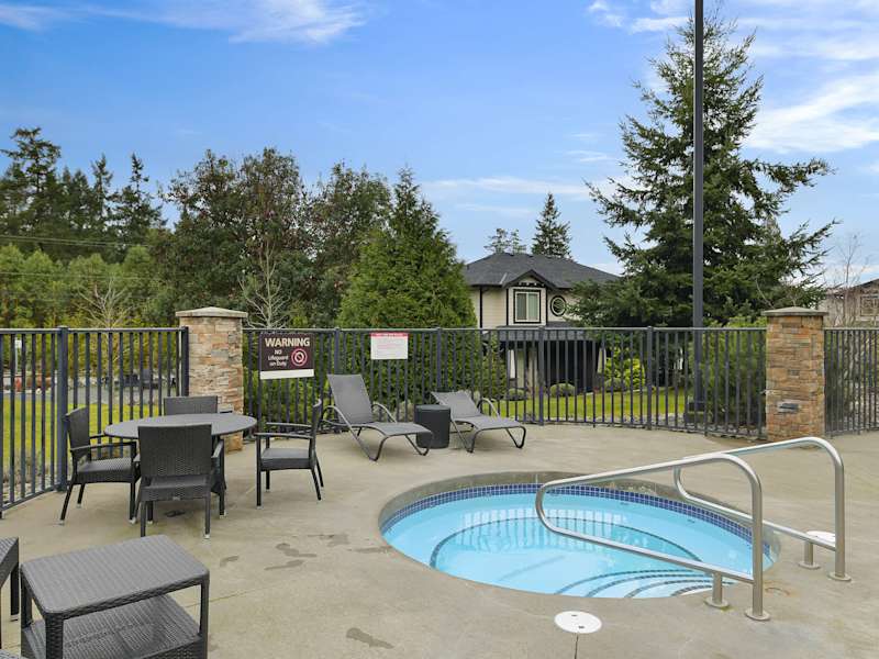 Common area hot tub and seating area.
