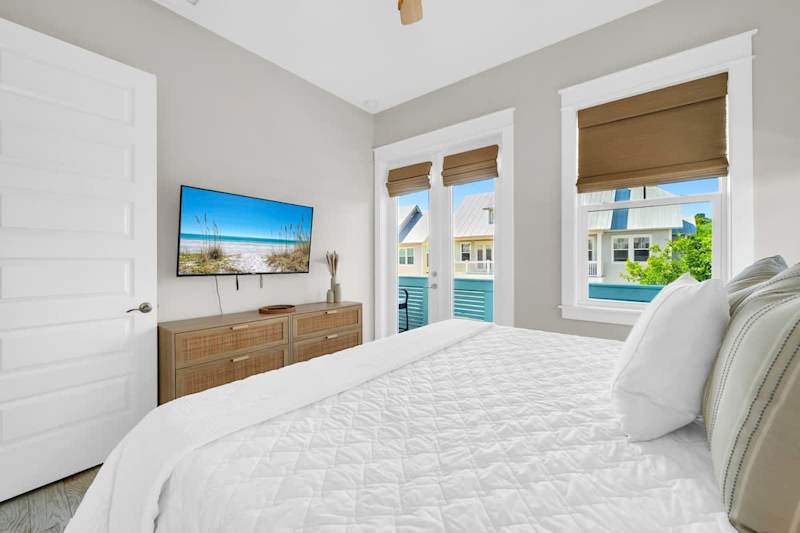 Guest bedroom features a smart tv.