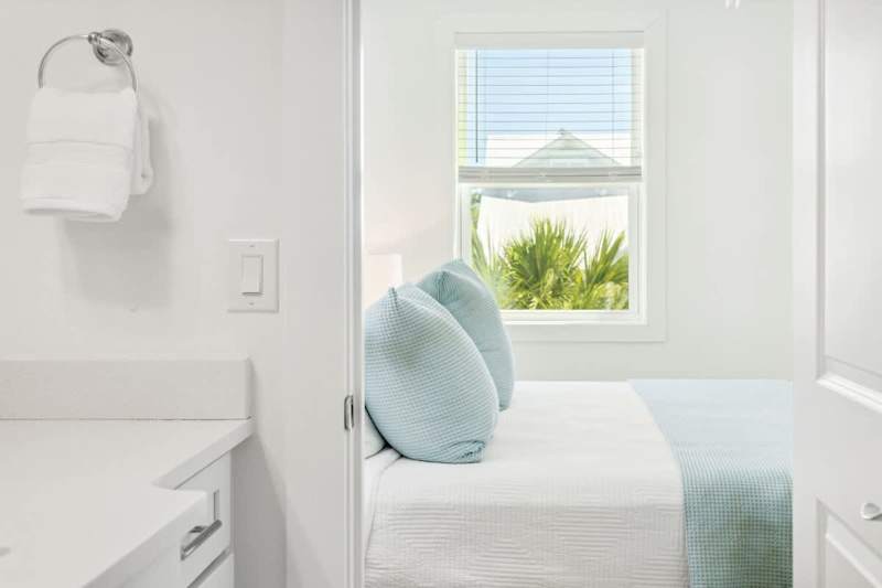 Bedroom #3 features a king bed, TV and ensuite.