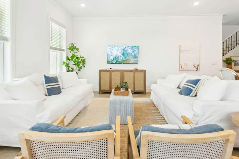 Living room has a smart TV that is perfect for watching movies!