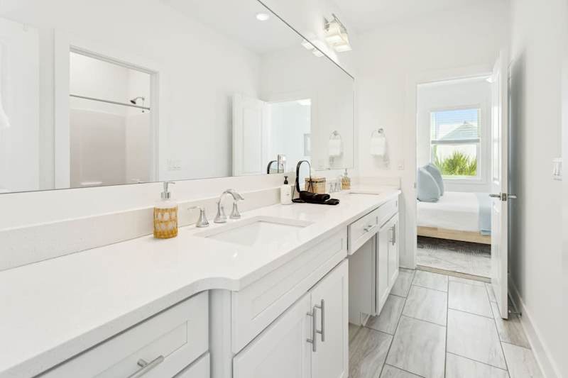 Jack-n-Jill bathroom between bedroom #2 and #3 complete with duel vanities and a shower/tub combo.