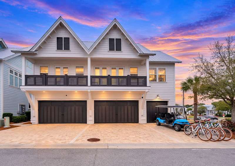 Large private balcony spans across the front of the home.