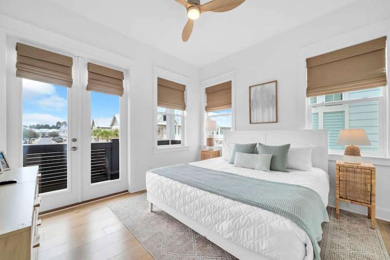 Guest bedroom features a king bed and smart tv.