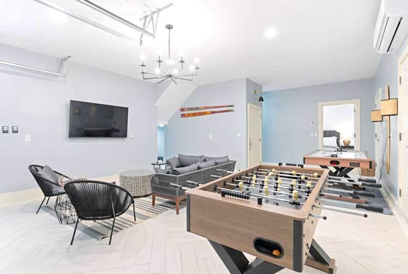 1st floor game room featuring air hockey, ping pong, foosball, mini putt, and darts.