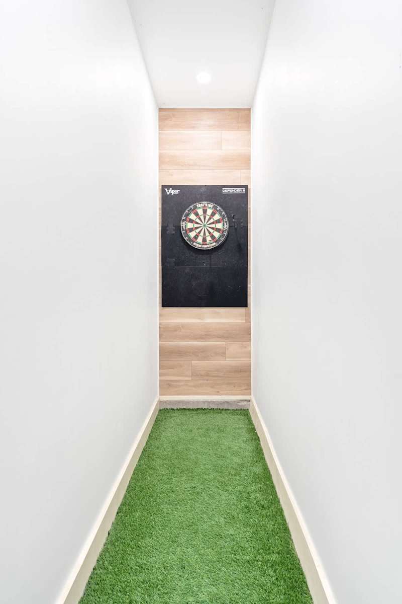 1st floor game room with mini putt and darts.