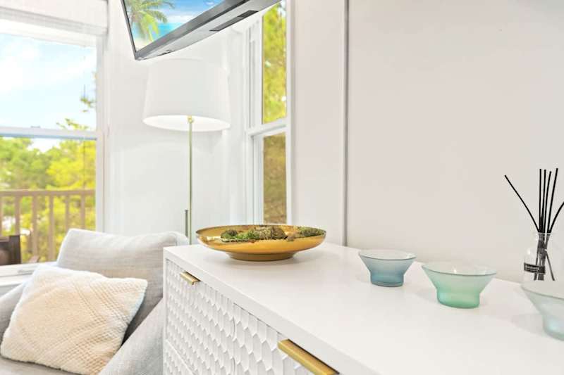 3rd floor primary bedroom with king size bed and private balcony.