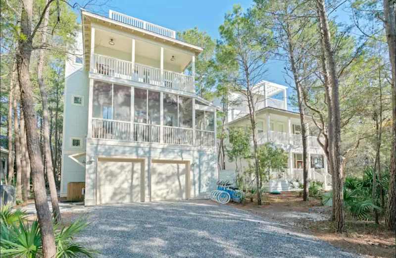 Home exterior with driveway parking for 4 cars.
