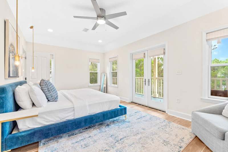 3rd floor primary bedroom with king size bed and private balcony.