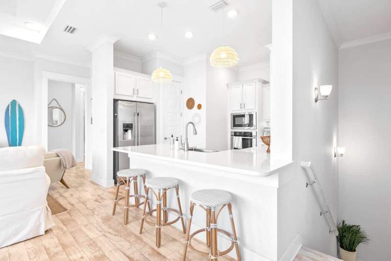 3 barstools at the large kitchen island.