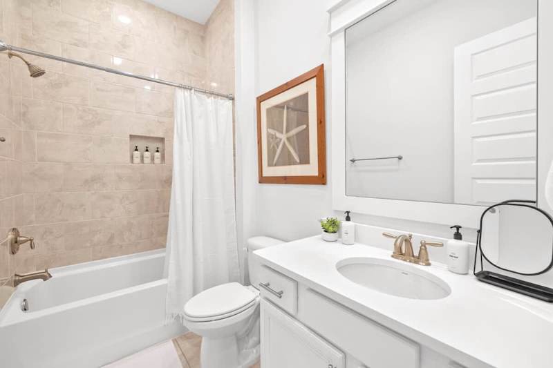 Guest bathroom with shower/tub combo.
