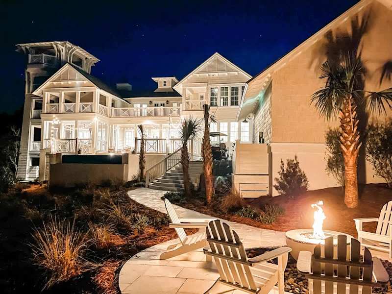 View from backyard of home! Gas fire pit is perfect for winding down at night! String lights on the back patio create the perfect relaxed ambiance!