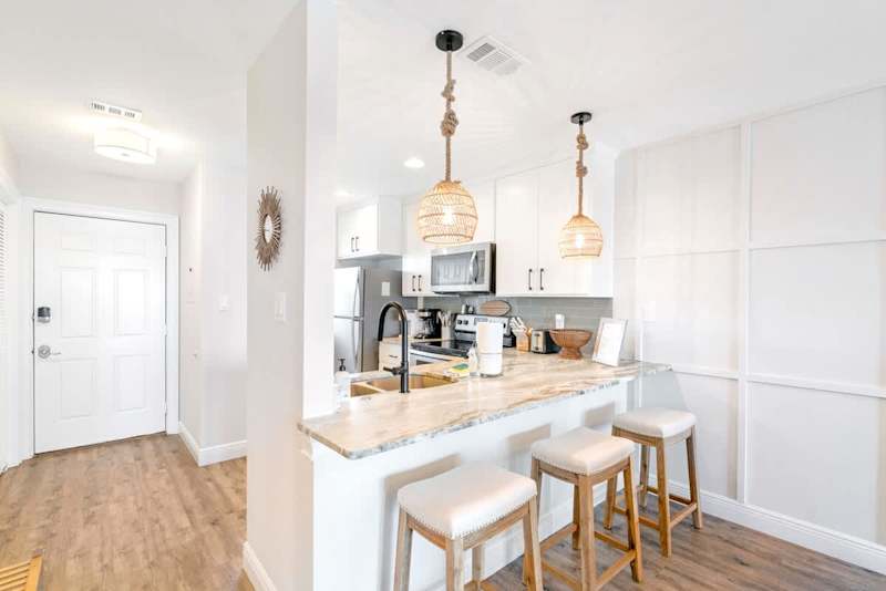 Kitchen features 3 seats at the counter.