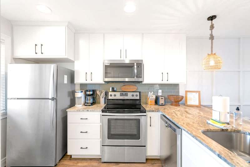 Fully stocked kitchen for cooking meals.