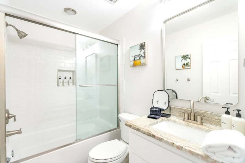 Upstairs bathroom with shower and tub combo.
