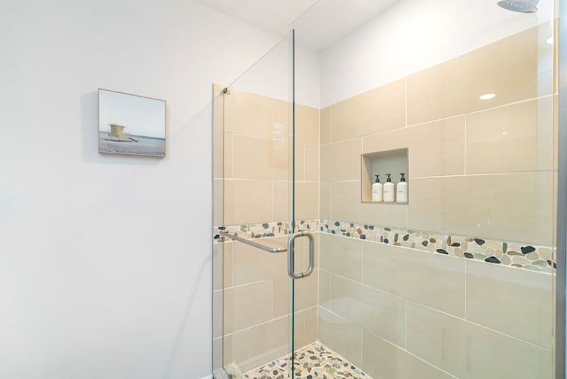 Large walk-in shower in primary bedroom.