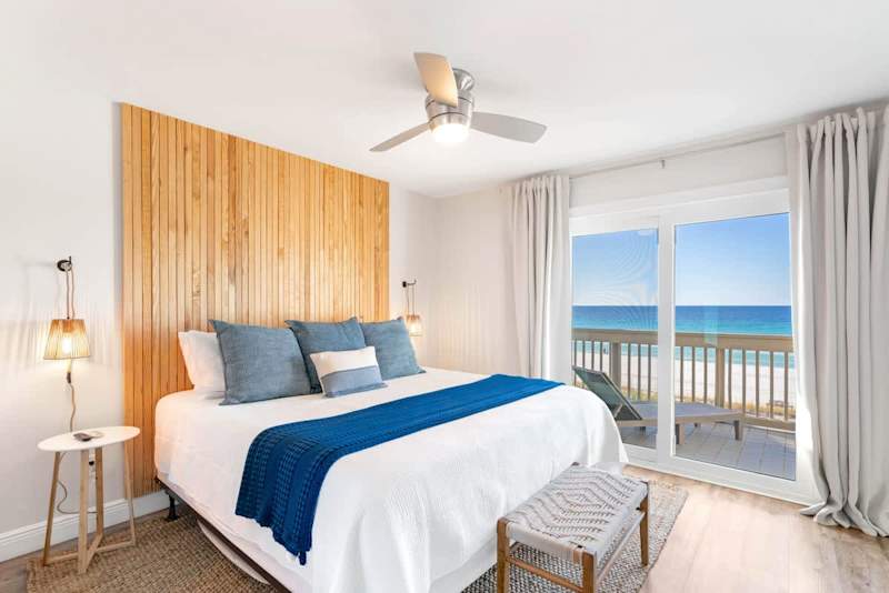 Primary bedroom features a king bed and beautiful views of the Gulf!