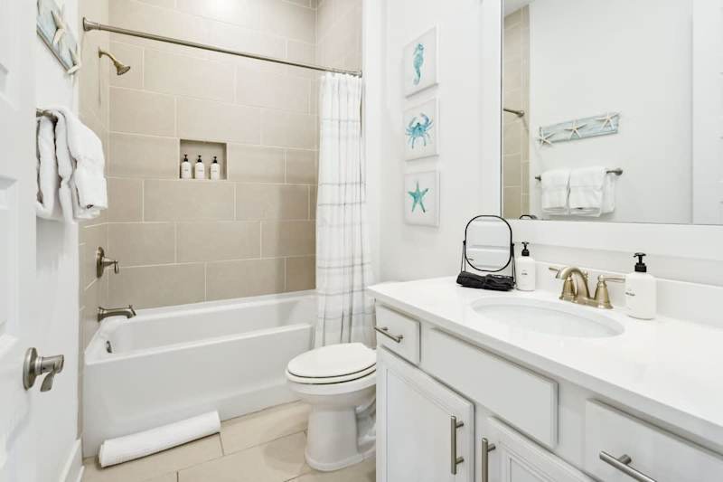 Hallway bathroom features a tub/shower combo!
