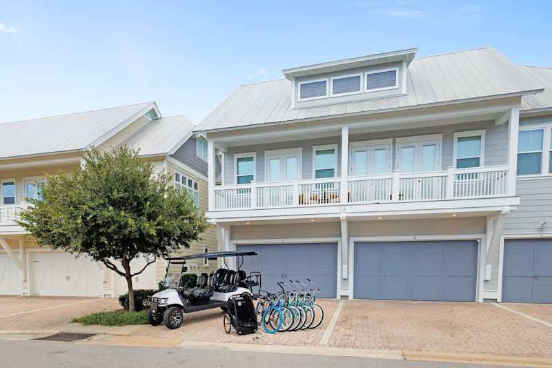 Home features two driveway parking spots in front of units garage.