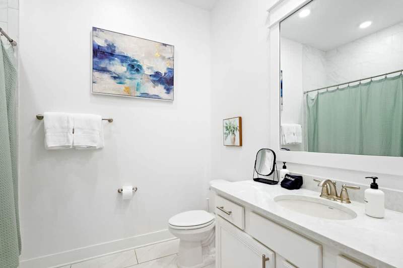 Second floor bathroom features a shower/tub combo.