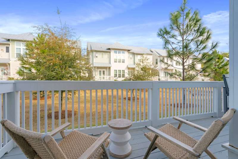 Private patio off living room features to seating areas.