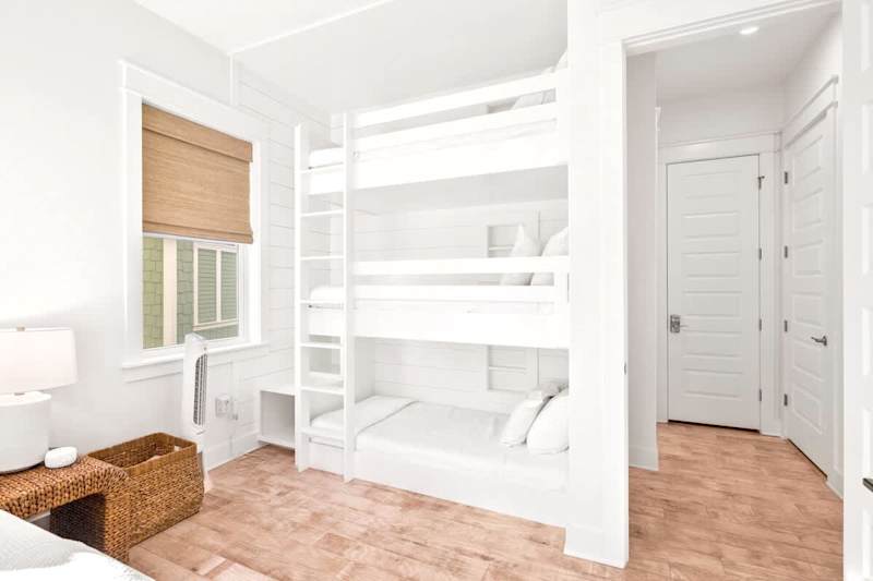 Triple twin bunk beds in guest bedroom.