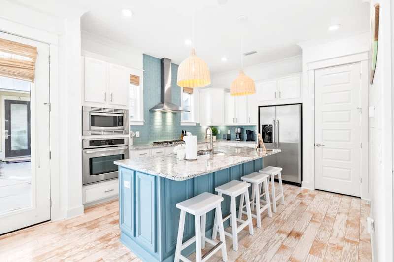 Large kitchen island provides seating for an additional 4 people.