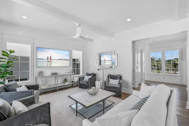 Living area offers plenty of seating and a 75" smart TV!