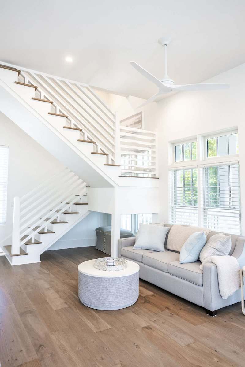 Stairs in carriage house to second floor. Living area features a Queen sleeper sofa.
