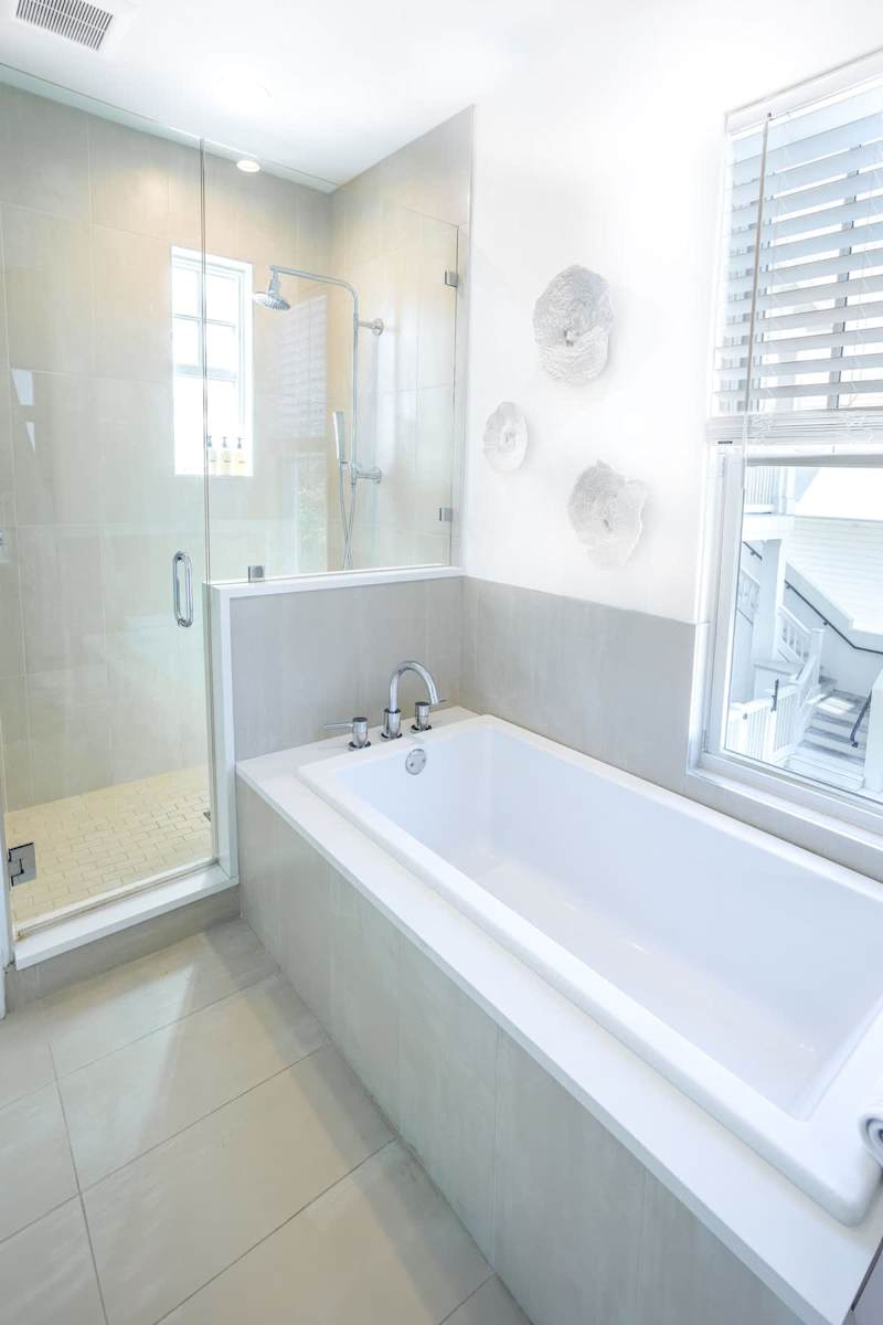 First floor of the carriage house features a full bath with tub and walk-in shower.