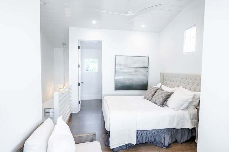Bedroom in carriage house loft has a walk-in closet and bathroom.