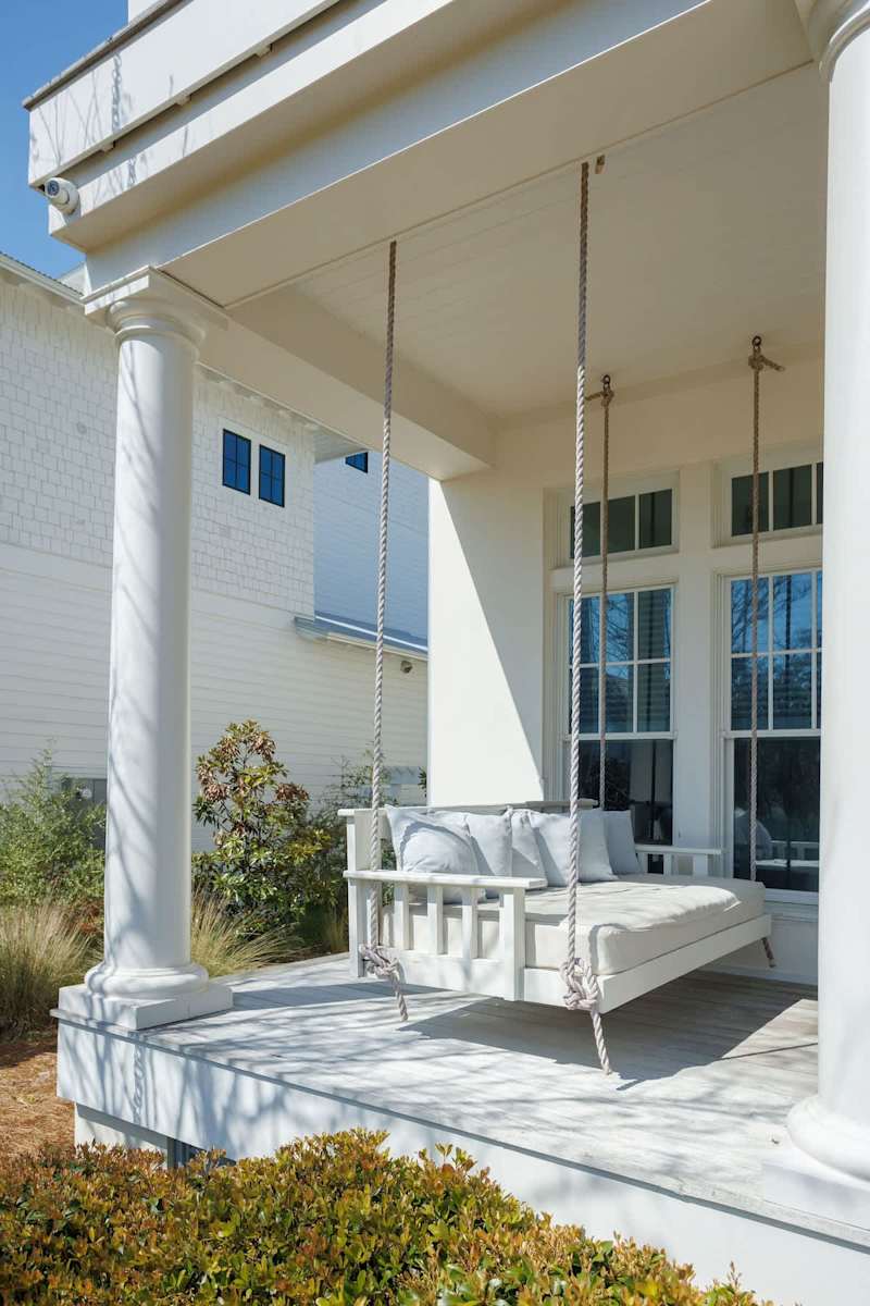 Large first floor patio has two porch swings and plenty of seating!