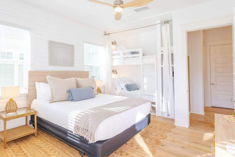 Guest bedroom features a Queen bed and custom twin-over-twin bunks.