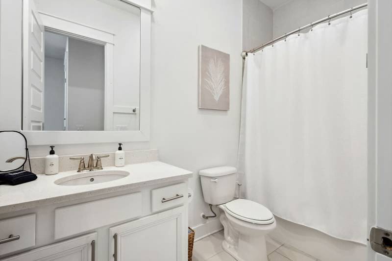 Second floor bathroom features a shower/tub combo.
