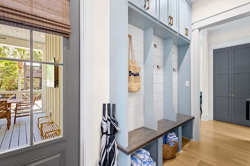 Custom built-in lockers by back door. Beach towels included!