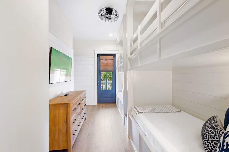 Bedroom #3 has custom built twin over twin bunk beds. Bedroom includes a smart tv, ensuite and access to expansive front balcony.