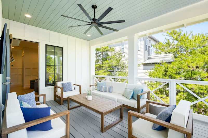 Third floor balcony includes ample seating.