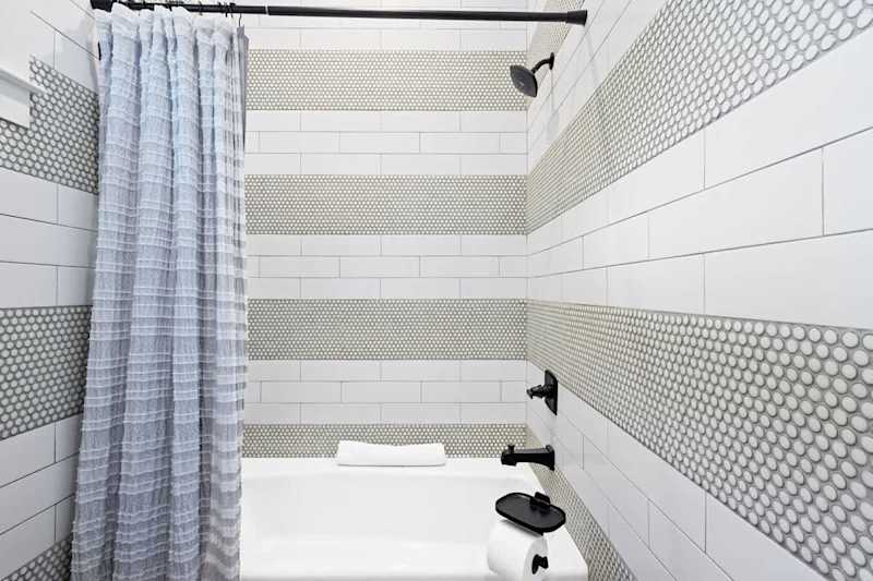 Bathroom features a shower/tub combo.