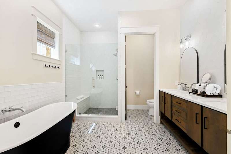 Bathroom complete with dual vanities, large soaker tub and walk-in shower.