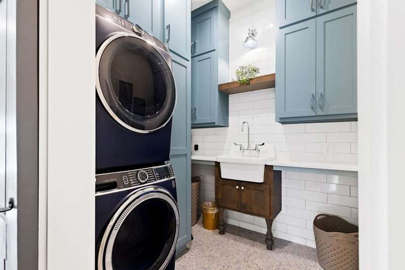 Second floor laundry room with full size washer and dryer.