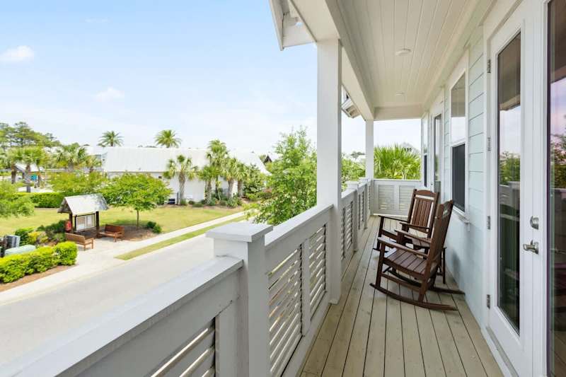 Large balcony spans across the front of the home- perfect for catching sunrise or sunset!