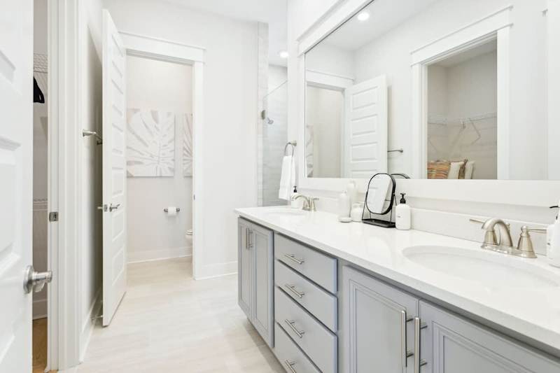 Bathroom with duel vanities and large walk-in shower.