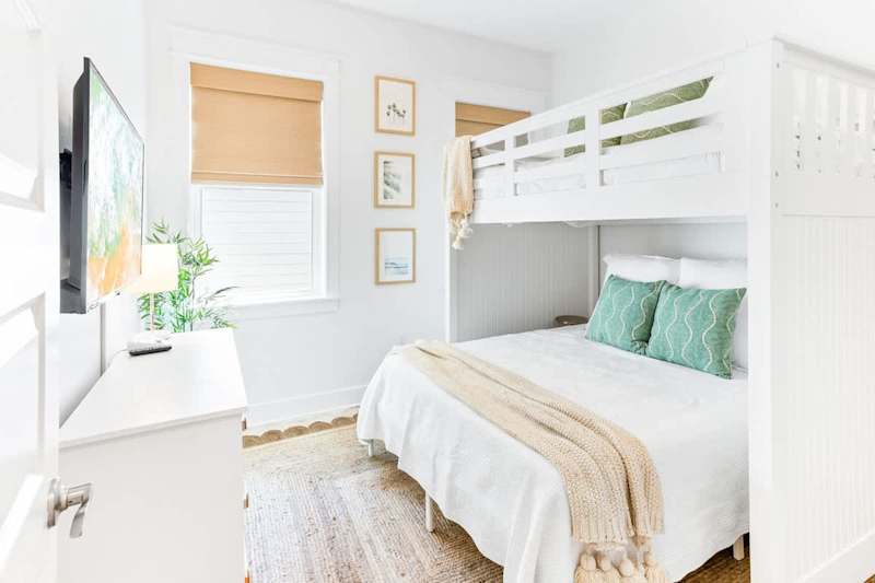 Bedroom #1 features a full over queen bunk and smart tv.