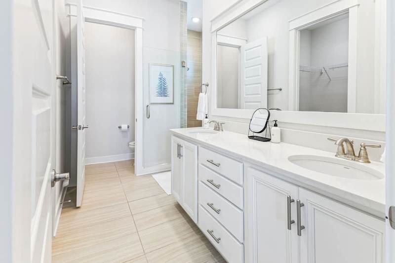 Bathroom with duel vanities and large walk-in shower.