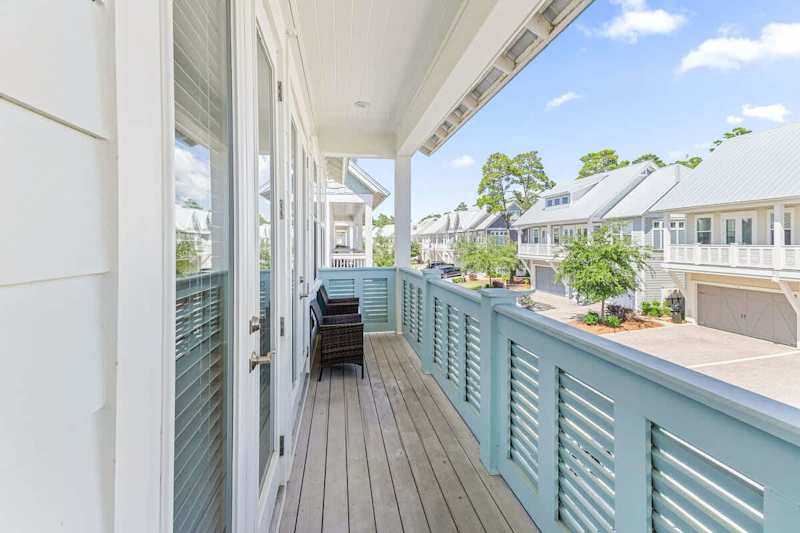 Large balcony spans across the front of the home- perfect for catching sunrise or sunset!