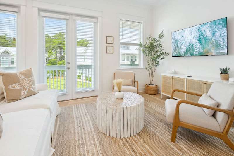 Living room space features a queen sleeper sofa.