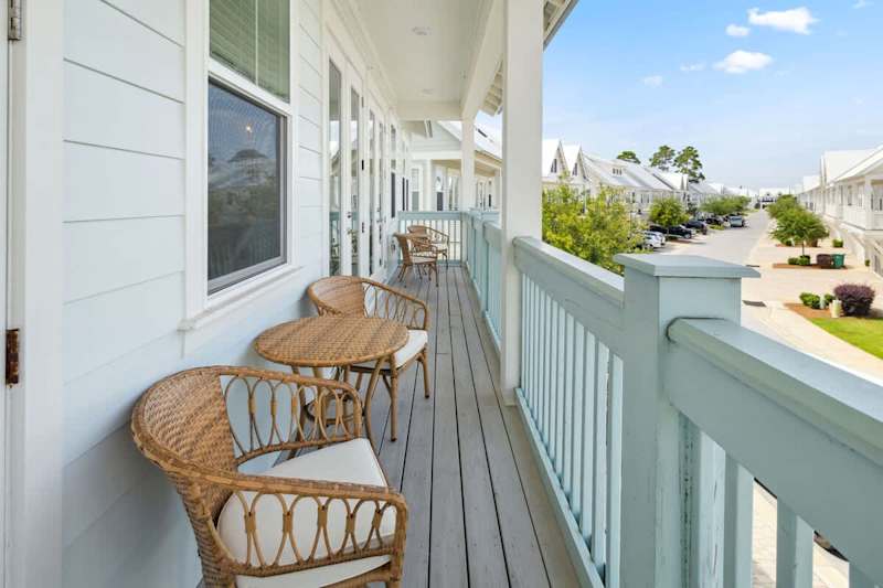 Large balcony spans across the front of the home- perfect for catching sunrise or sunset!